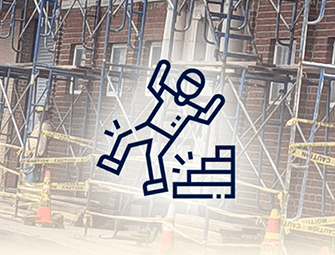 A construction worker falling off of some stairs.